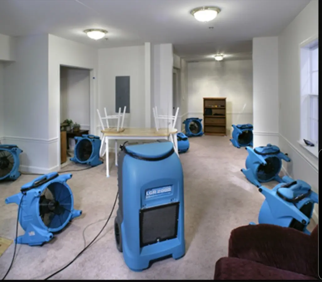Air movers and dehumidifier setup for Water Damage Restoration in Garfield